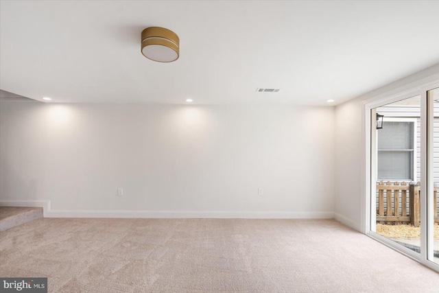 basement with carpet flooring, recessed lighting, and visible vents