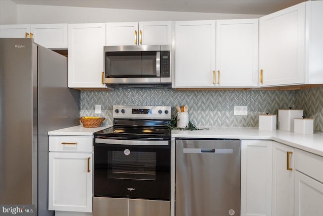 kitchen with white cabinetry, tasteful backsplash, appliances with stainless steel finishes, and light countertops