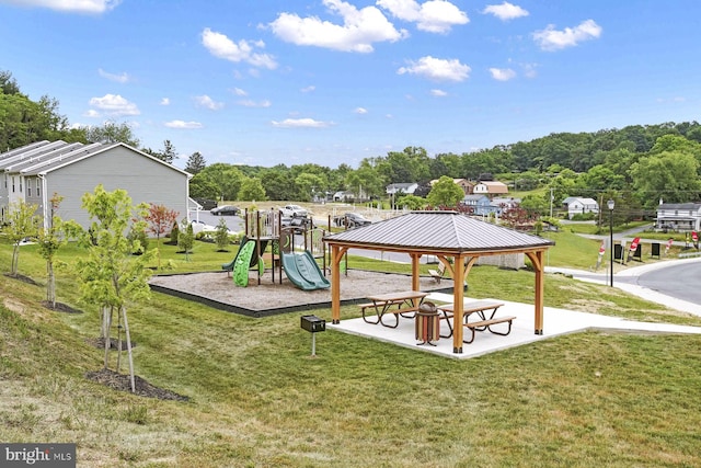 community play area with a gazebo and a lawn