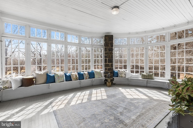 unfurnished sunroom with plenty of natural light