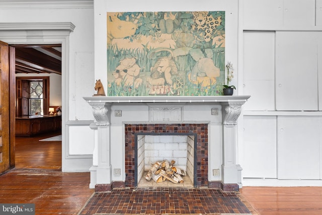 room details featuring a fireplace and wood finished floors