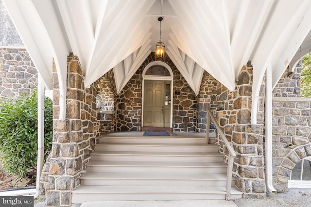 entrance to property with stone siding