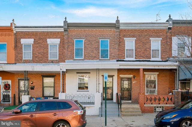 view of property featuring brick siding