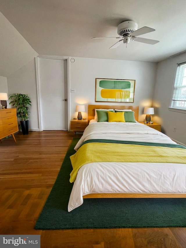 bedroom with a ceiling fan and wood finished floors