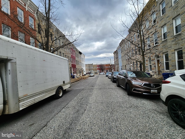 view of road featuring street lighting and sidewalks