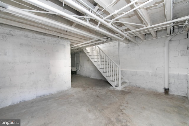 unfinished basement with stairs