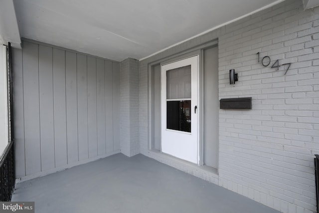 entrance to property with brick siding