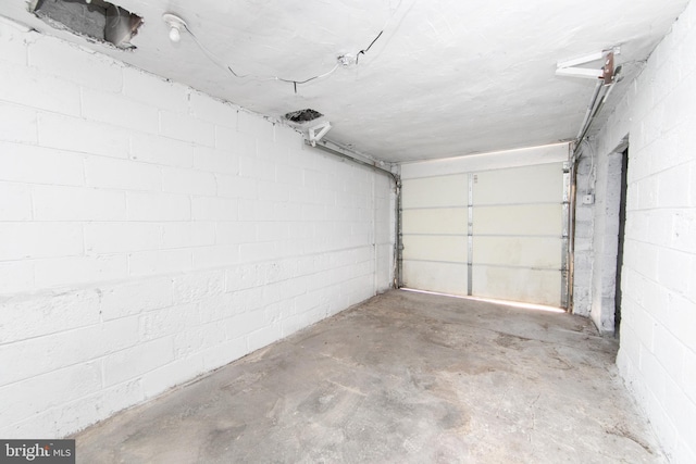 garage with concrete block wall