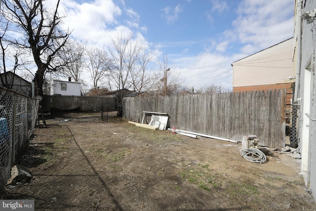 view of yard with a fenced backyard