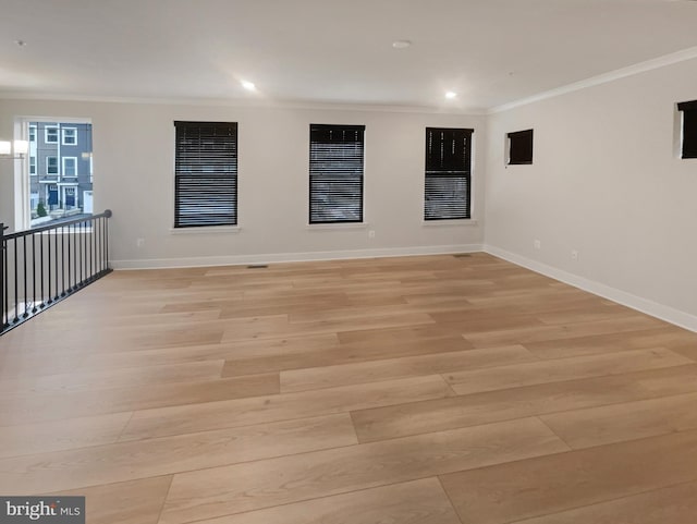 unfurnished room with recessed lighting, baseboards, crown molding, and light wood finished floors