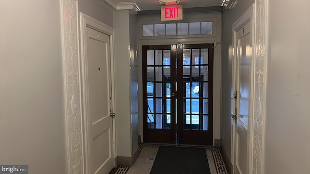 doorway to outside featuring french doors and ornamental molding