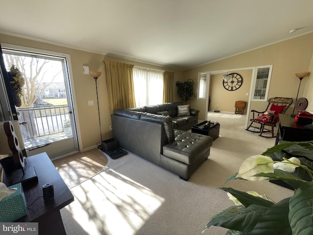 living area with light colored carpet, baseboards, lofted ceiling, and ornamental molding