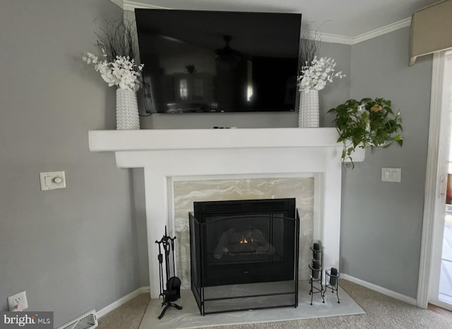 interior details with carpet flooring, crown molding, baseboards, and a premium fireplace