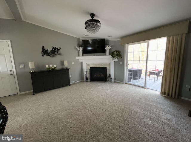 unfurnished living room with a fireplace with flush hearth, baseboards, and carpet floors