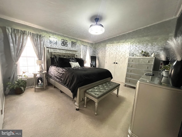 bedroom featuring wallpapered walls, crown molding, and light carpet