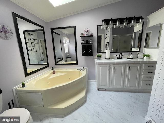 bathroom with a shower stall, ornamental molding, a tub with jets, marble finish floor, and vanity