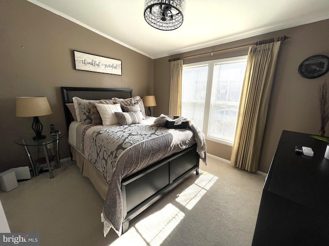 bedroom with vaulted ceiling, light colored carpet, baseboards, and ornamental molding