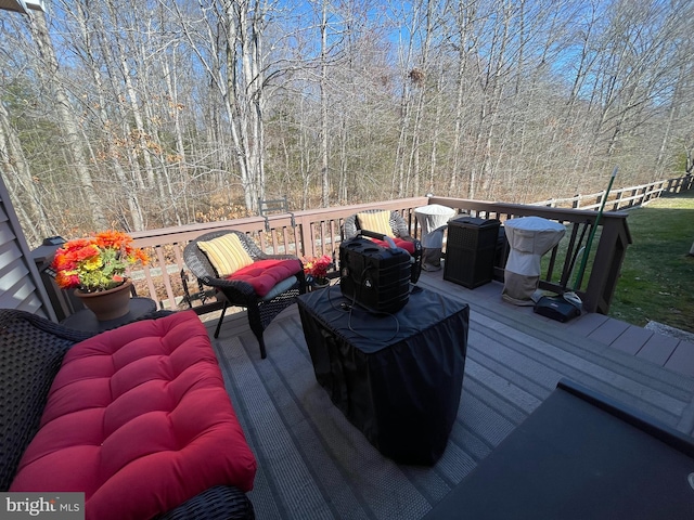 deck featuring a forest view