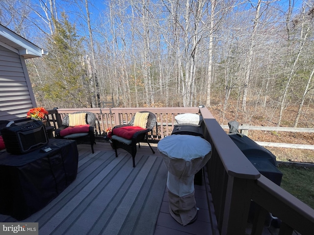 deck featuring a wooded view