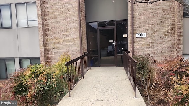 entrance to property with brick siding