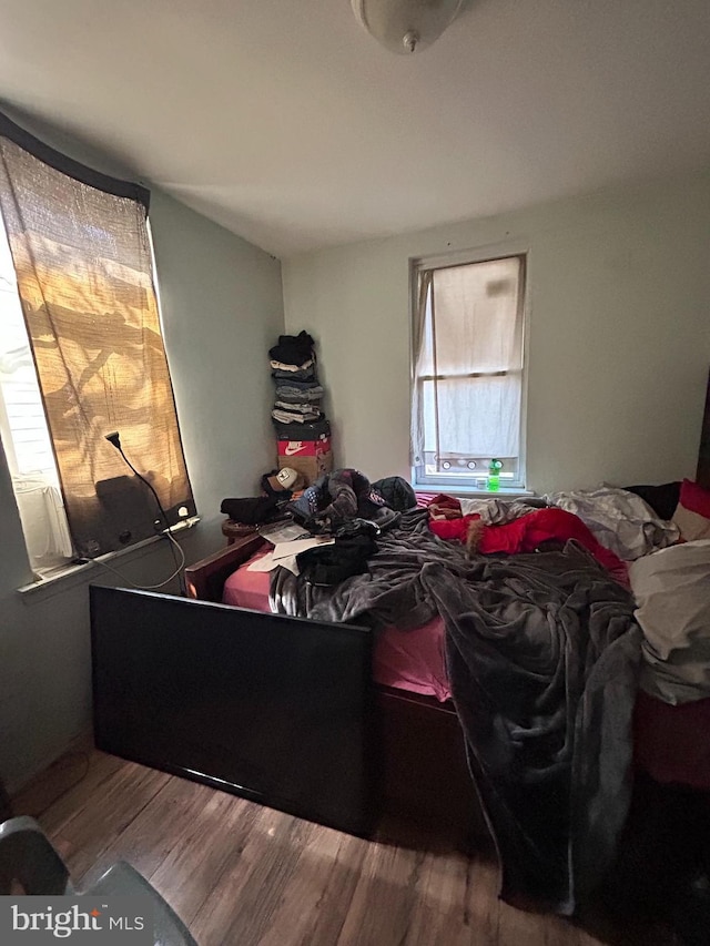 bedroom featuring wood finished floors