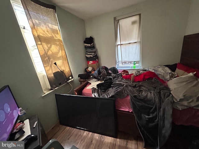 bedroom featuring wood finished floors