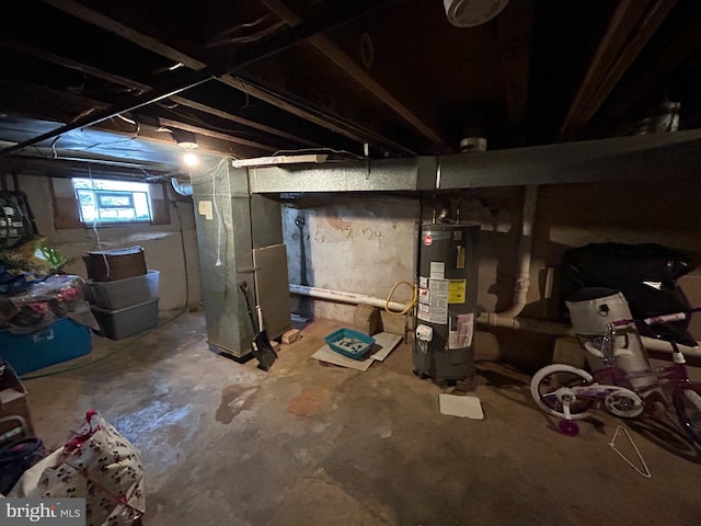 basement featuring water heater and heating unit