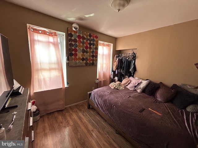 bedroom with wood finished floors