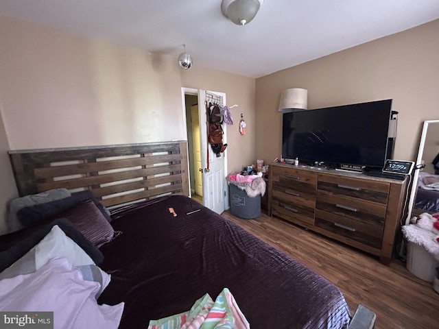 bedroom featuring wood finished floors