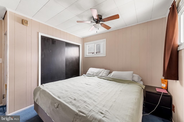 bedroom featuring a closet and a ceiling fan