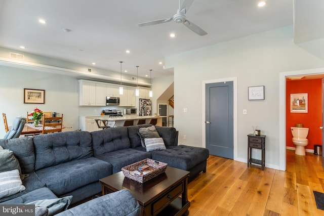 living area featuring visible vents, recessed lighting, light wood-style floors, and ceiling fan