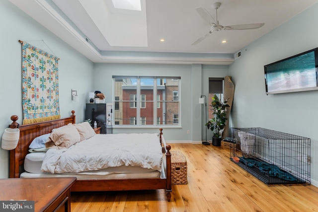 bedroom with visible vents, a ceiling fan, wood finished floors, recessed lighting, and baseboards