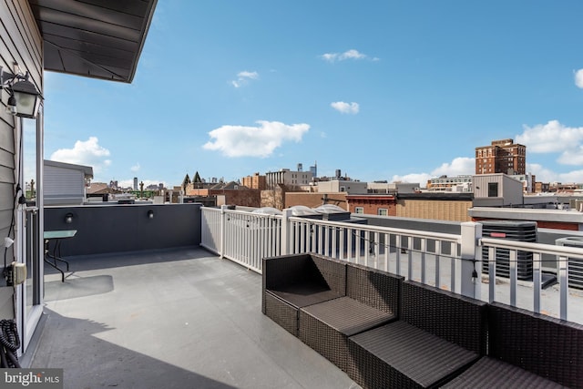 view of patio with a city view and a balcony