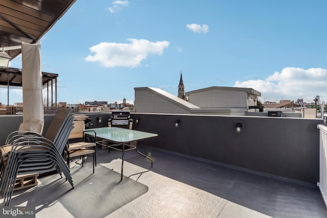 view of patio featuring a view of city and a balcony