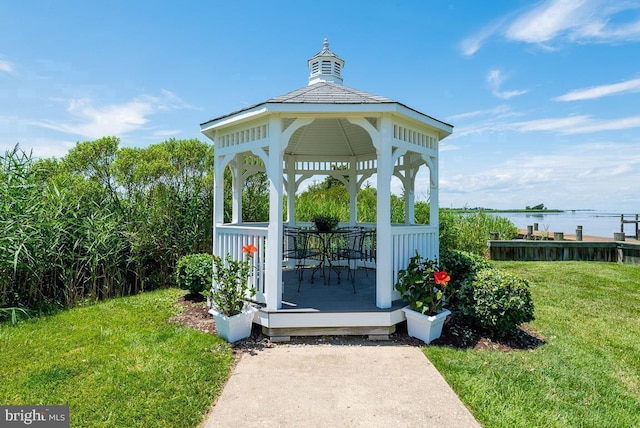 view of home's community featuring a gazebo, a water view, and a lawn