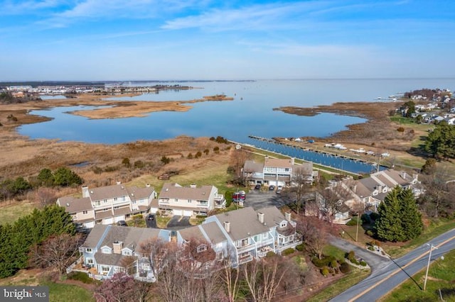 bird's eye view featuring a residential view and a water view