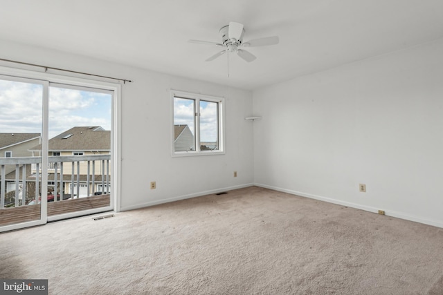 unfurnished room featuring a ceiling fan, baseboards, and carpet floors