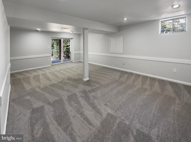 below grade area with carpet flooring, recessed lighting, and baseboards