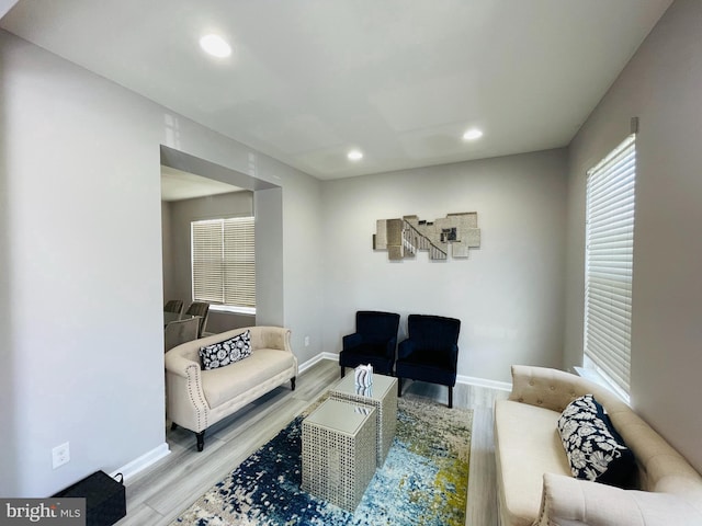 living room with recessed lighting, wood finished floors, and baseboards