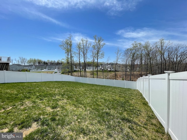 view of yard with a fenced backyard