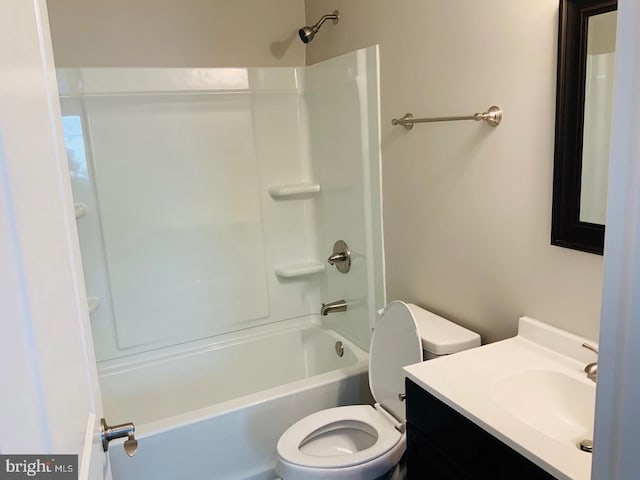 bathroom with vanity, toilet, and tub / shower combination