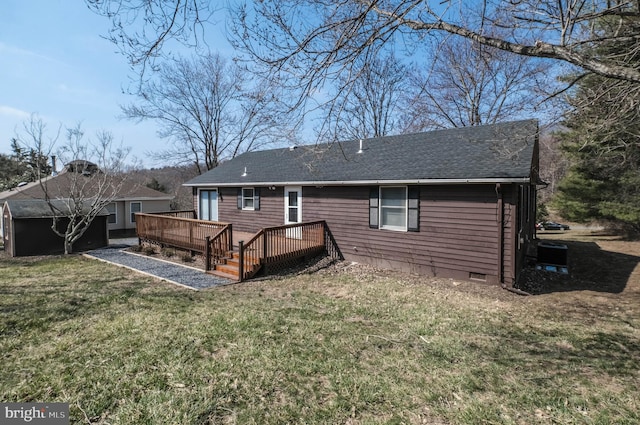 rear view of house featuring a shingled roof, crawl space, a lawn, and a wooden deck