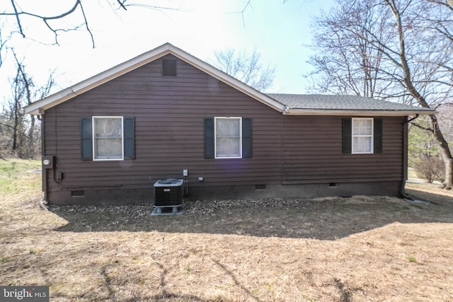 back of property with crawl space and central AC unit