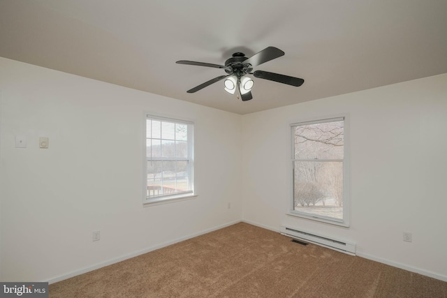 carpeted empty room featuring a baseboard heating unit, baseboards, and a ceiling fan