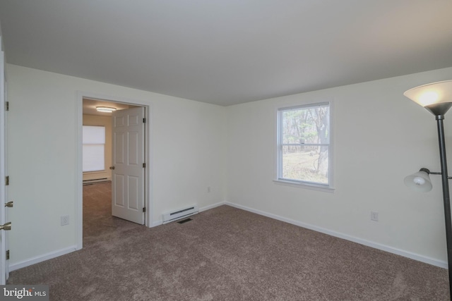 carpeted spare room featuring a baseboard heating unit, baseboards, and a baseboard radiator