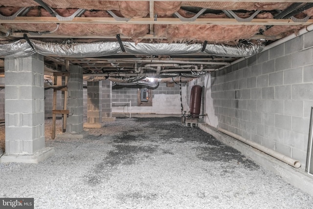 unfinished basement featuring electric panel