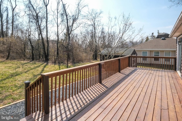 wooden deck with a yard