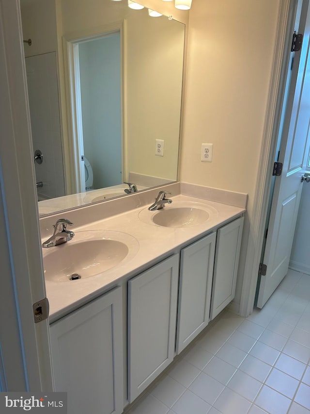 12 Chase Cir, Elkton, MD 21921 - full bath with toilet, double vanity, a sink, and tile patterned floors