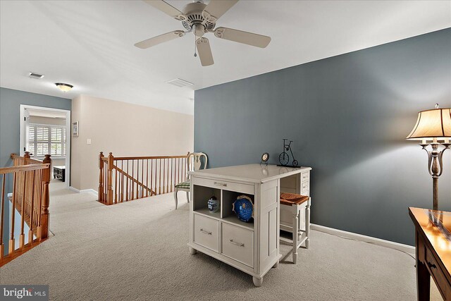 playroom featuring baseboards, a ceiling fan, visible vents, and light carpet