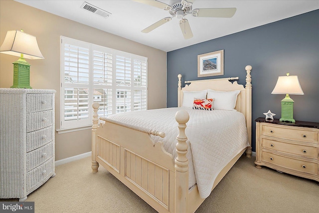 bedroom with a ceiling fan, light colored carpet, visible vents, and baseboards